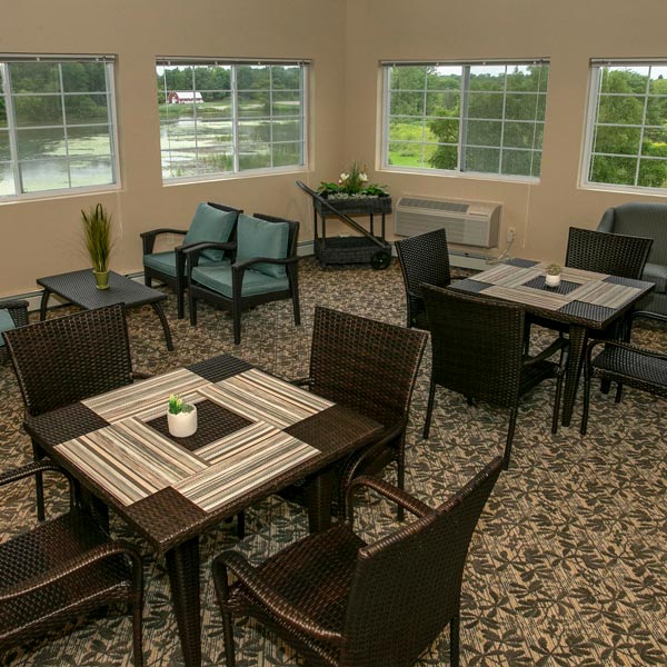 gathering room with tables and chairs